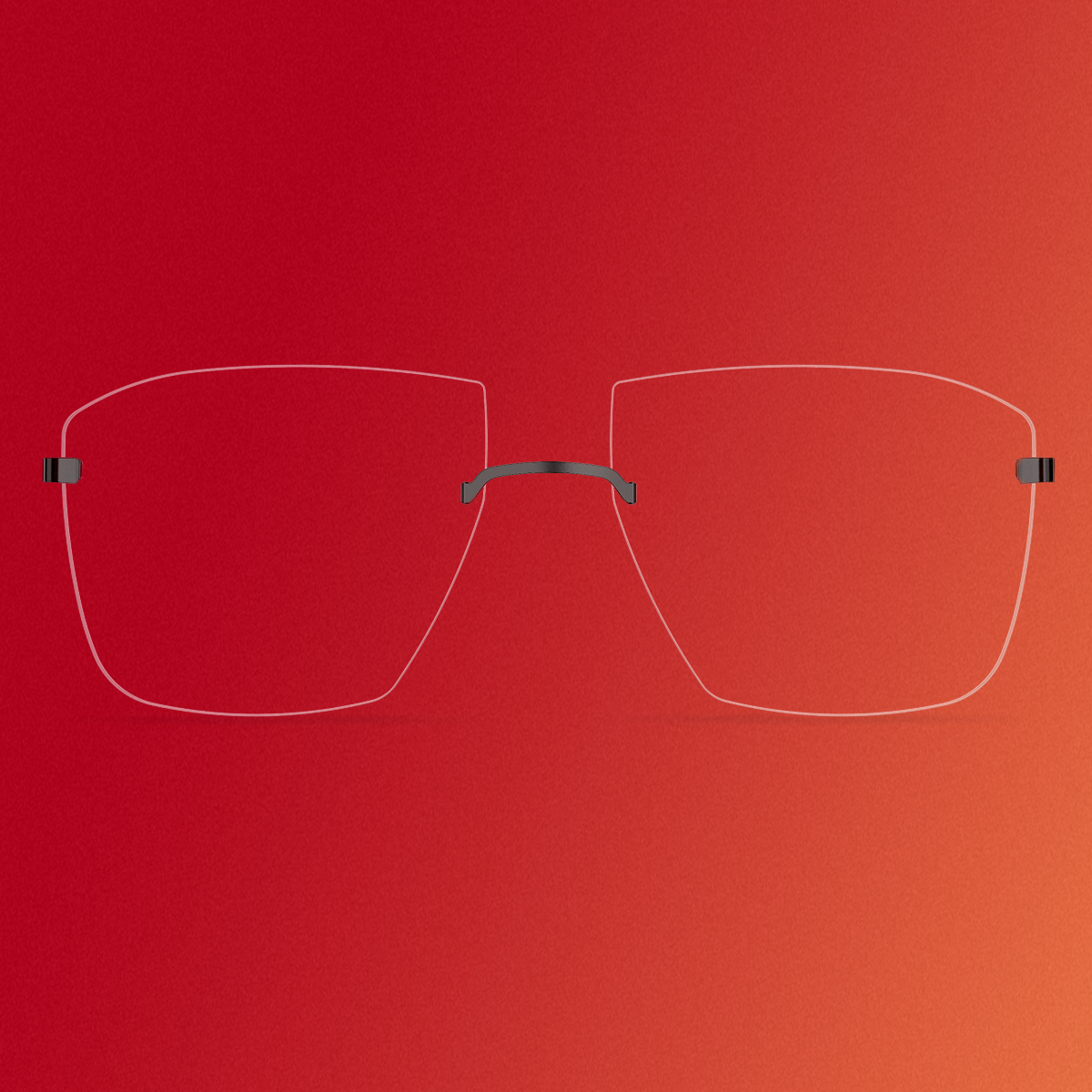 Detailansicht einer randlosen Brille mit eckigen Gläsern und schwarzen Titanakzenten, Modell 2451 aus der Kollektion LINDBERG spirit, in einem Editorial für das DANSK-Magazin
