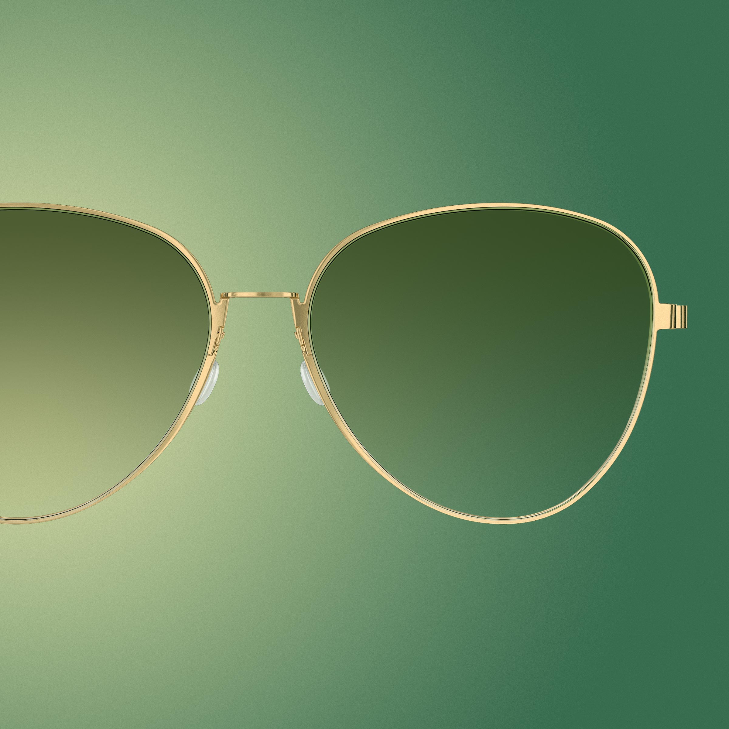 IDEAT-Magazinseite mit LINDBERG-Pilotenbrille mit goldener Titanfassung und grün getönten Gläsern mit Farbverlauf, Modell 8908 PGT