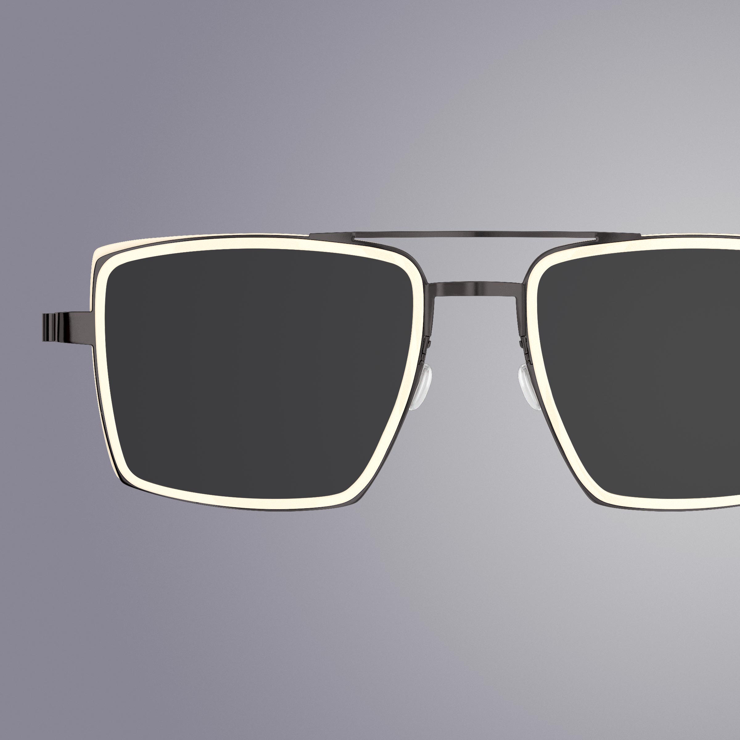 IDEAT-Magazinseite mit eckiger LINDBERG-Titanbrille in Schwarz mit weißer Innenfassung aus Acetat, Modell 8418